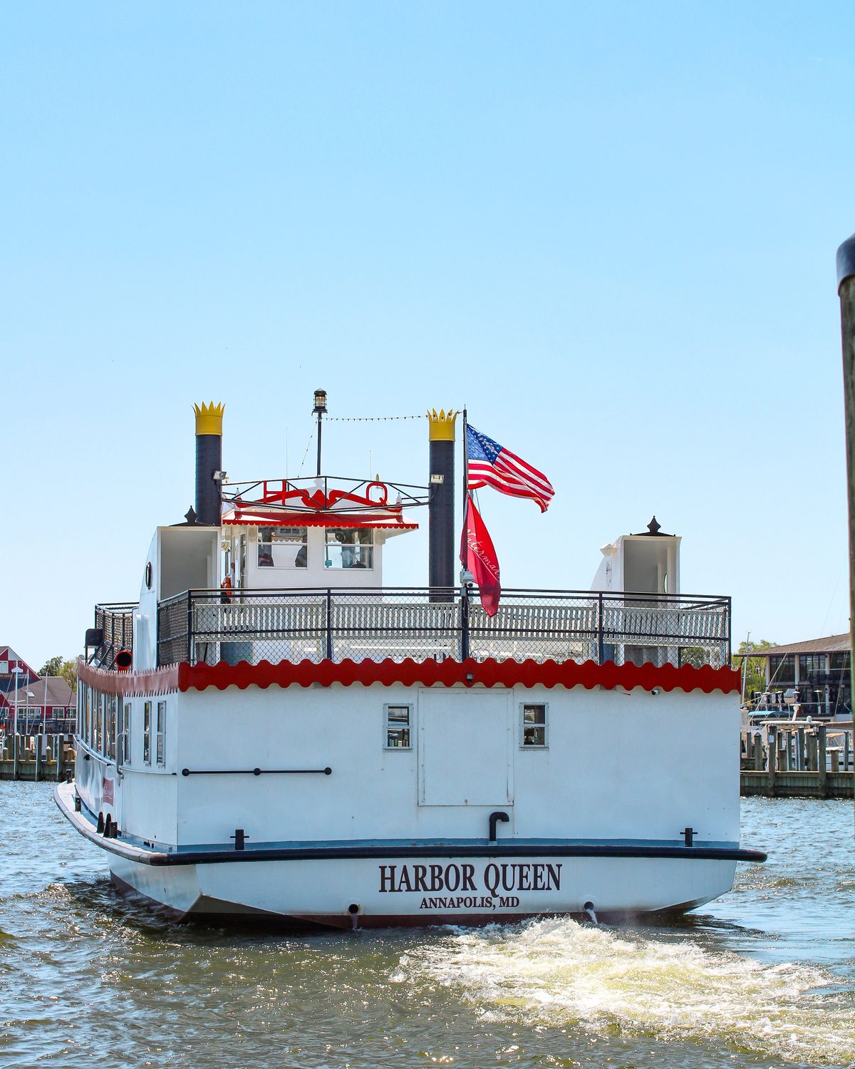 A flag flying hard in the wind off the water at Annapolis, Maryland